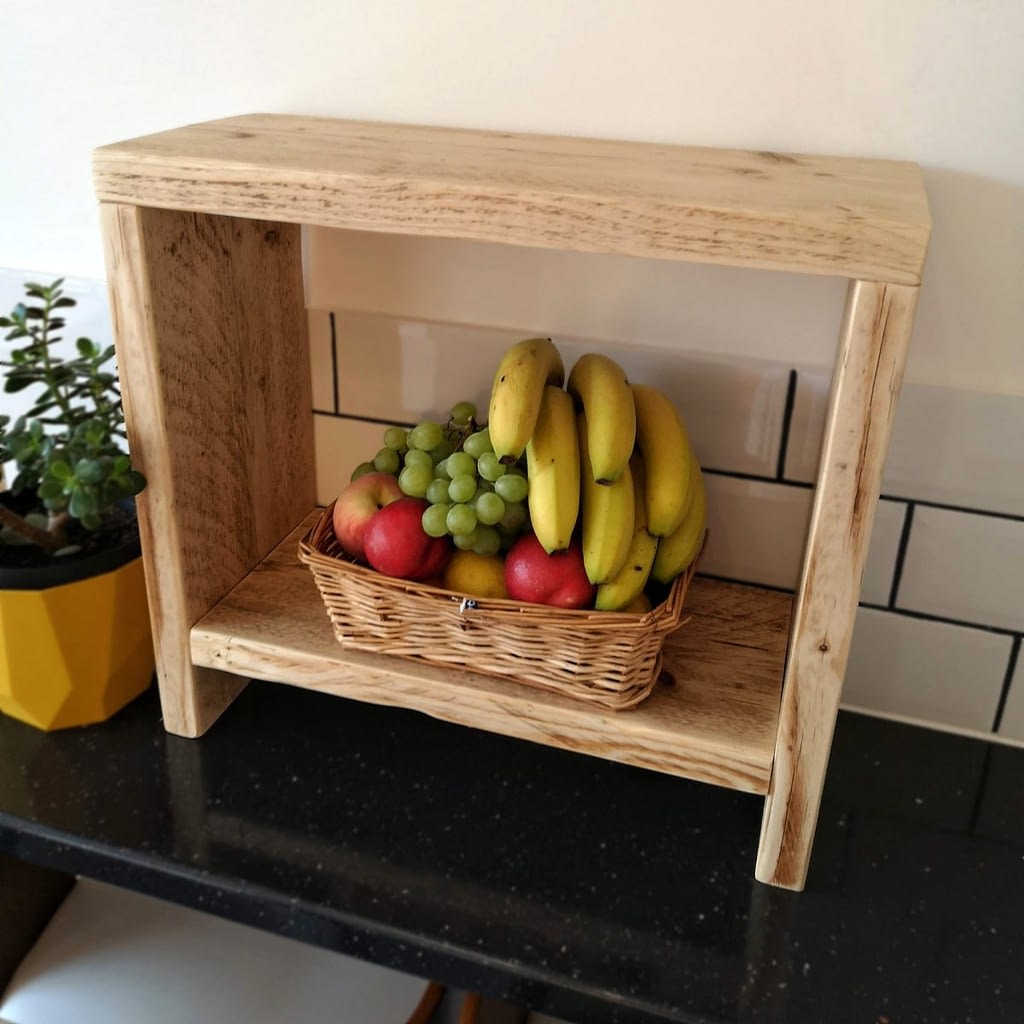 A reclaimed timber counter-top side table with fruit on