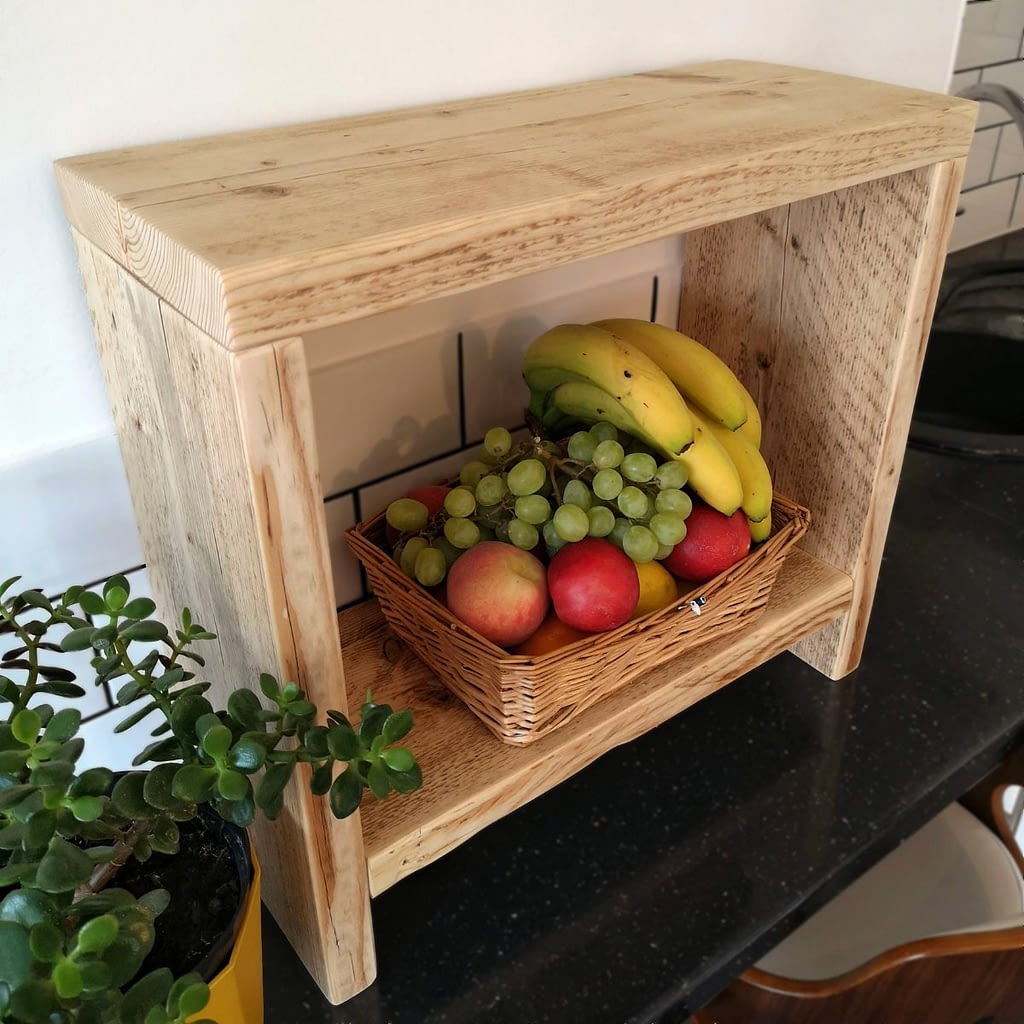 A reclaimed timber counter-top side table with fruit on