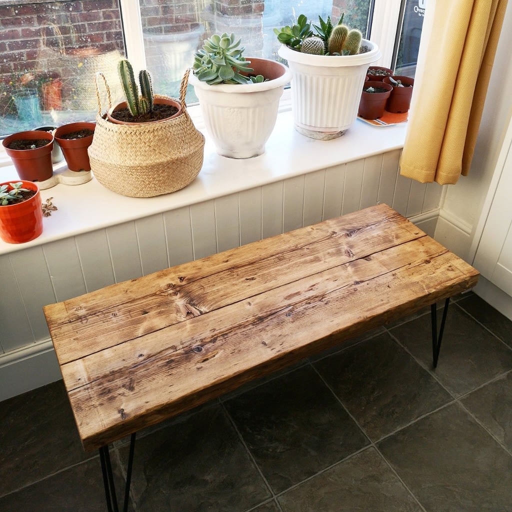 A thick medium oak rustic coffee table with hairpin legs